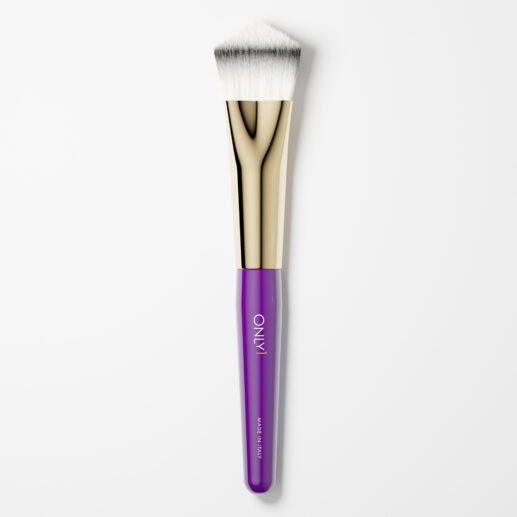 Purple and gold angled makeup brush with dense white bristles on a plain white background.