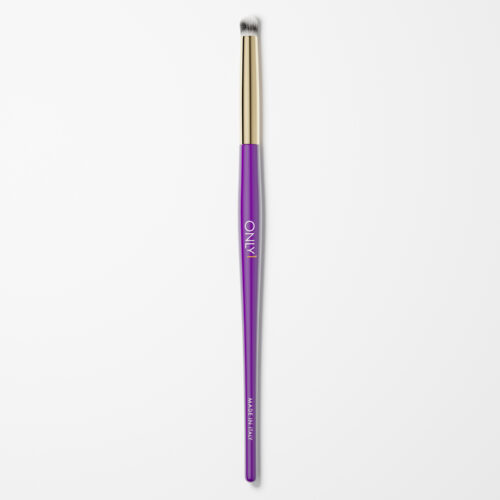 Pencil makeup brush with a purple handle, gold accents, and white bristles on a plain white background.