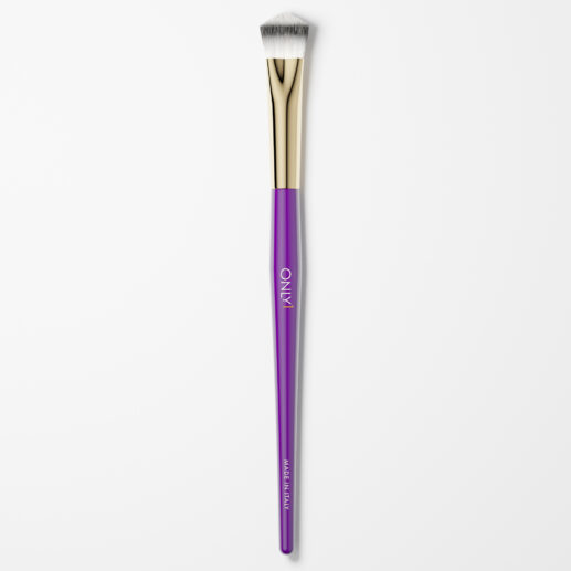 Small concealing brush with a purple handle, gold accents, and white bristles on a plain white background.
