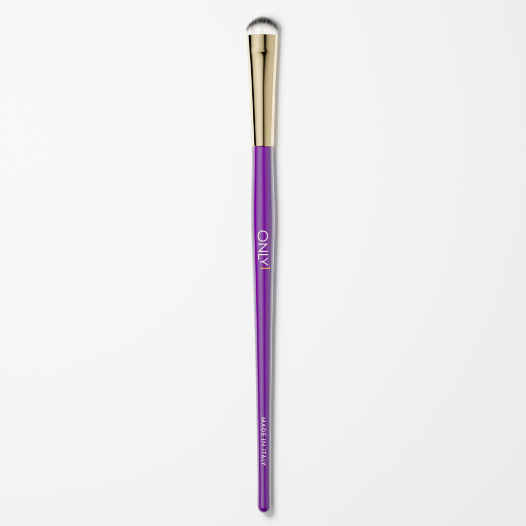 Dense shading brush with a purple handle, gold accents, and white bristles on a plain white background.