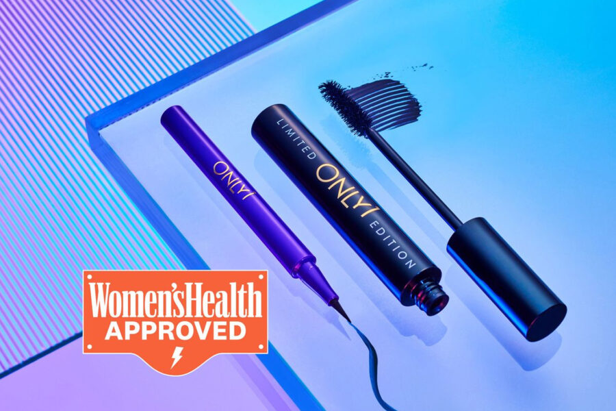 Purple eyeliner and black limited edition mascara on a reflective blue surface with a "Women's Health Approved" badge